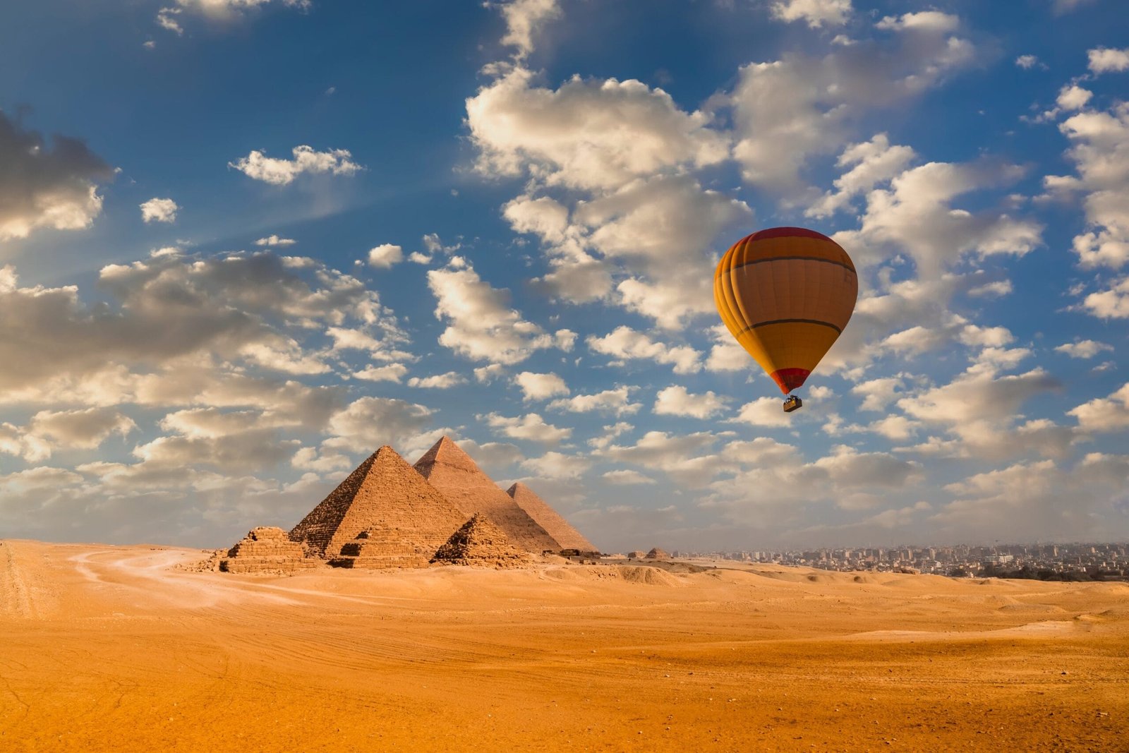 egypt_sunset-view-of-pyramid-complex-of-giza-in-cairo-2022-01-18-20-36-46-utc_resized